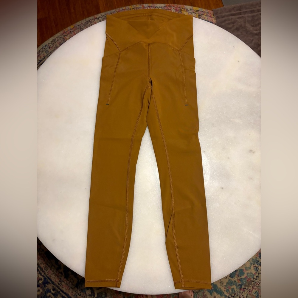 Lululemon Power Thru High-Rise Tight 25" Copper Brown Leggings.